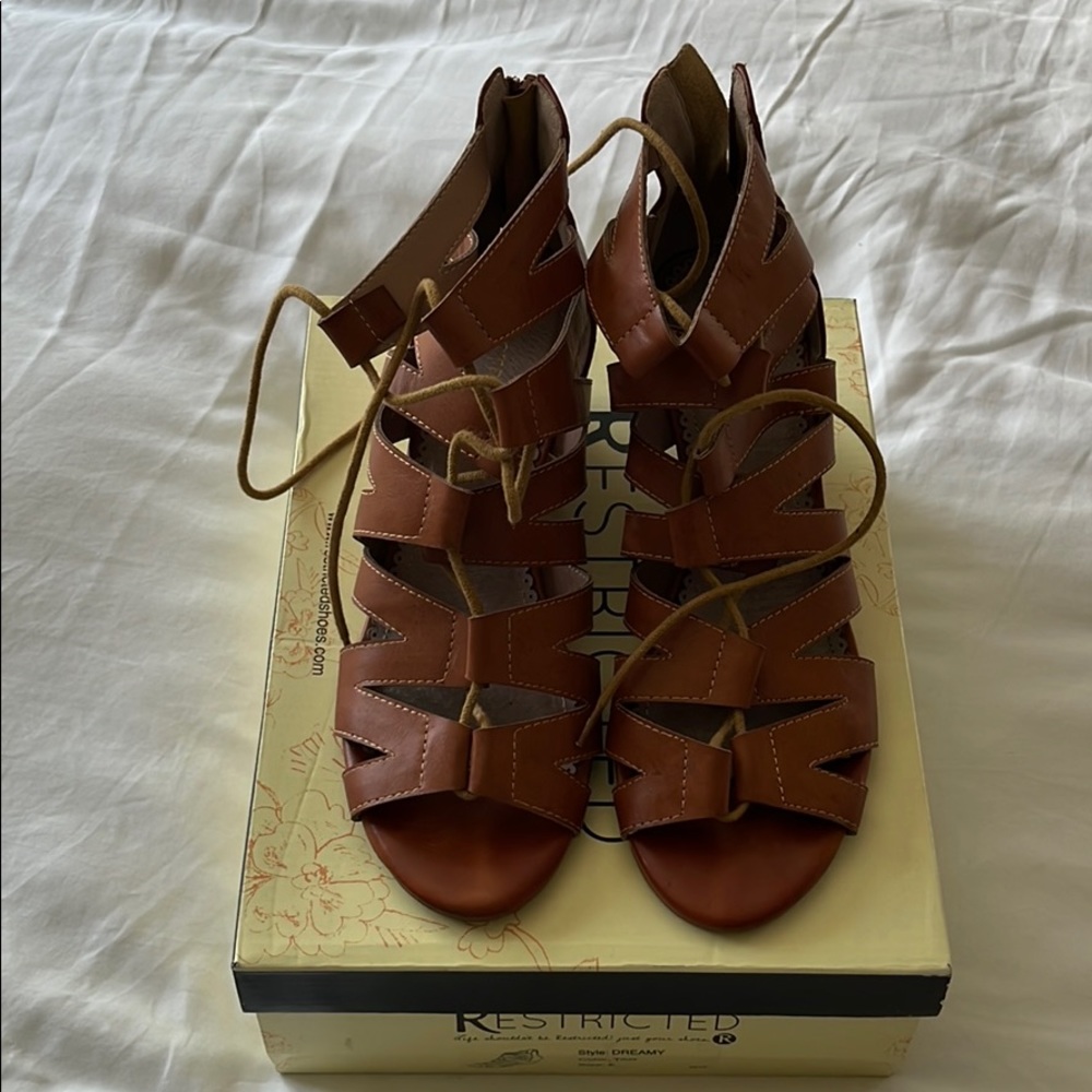 Restricted strap heel sandal